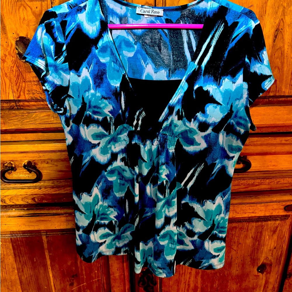 Gorgeous blouse with teals, white, and navy blue flower accents.